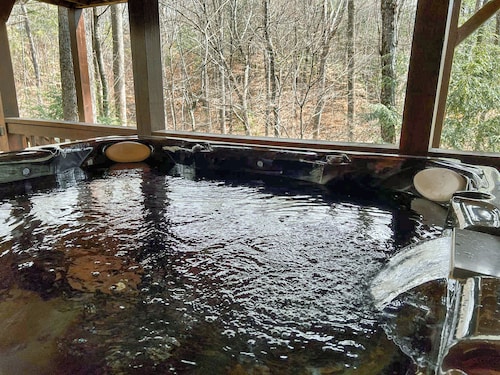 Discover tranquility at Hidden Oasis, a charming home nestled in serene Cherry Log Mountain