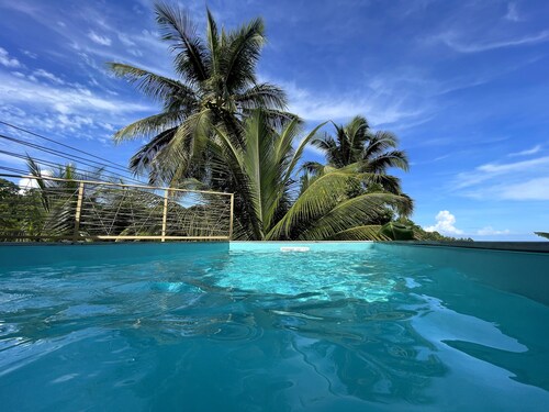 10 minutes from Malendure beach, new apartment with sea view and private pool