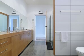 Shower, hair dryer, towels, toilet paper