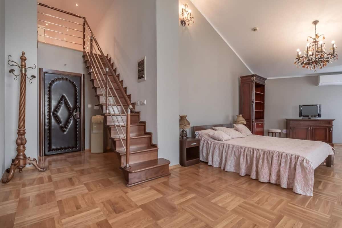 Deluxe Penthouse, Balcony, City View | 2 bedrooms, desk, laptop workspace, bed sheets
