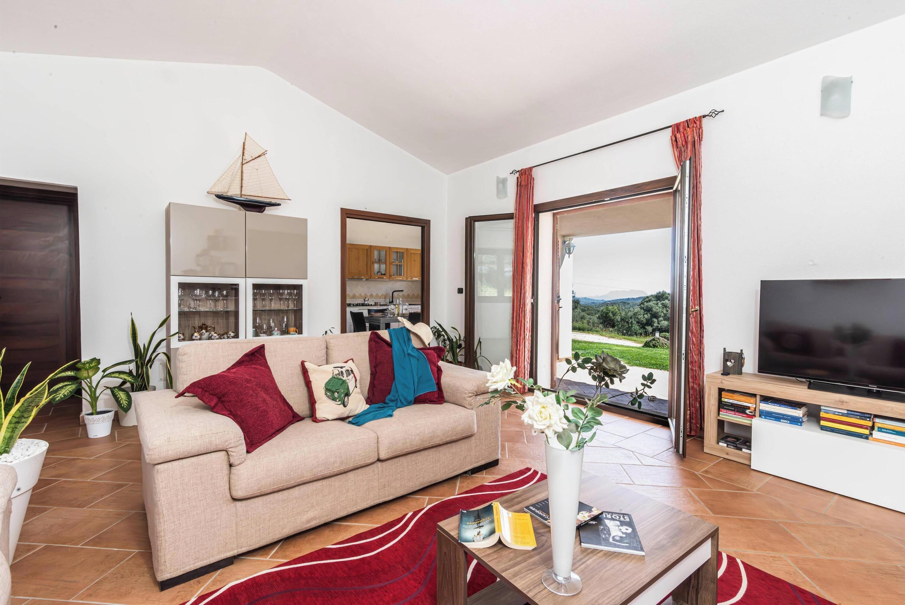 Apartamento familiar, varias habitaciones, 2 baños (La Suara Manna) | Zona de estar | Televisión de pantalla plana de 21 pulgadas con canales por cable