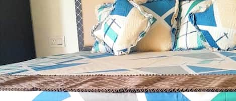 Desk, laptop workspace, bed sheets