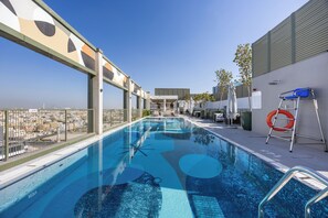 Seasonal outdoor pool, open 7:00 AM to 10:00 PM, pool loungers - Mood Living 22 (Dubai)