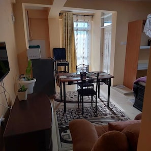 Superior Studio Suite, City View | Living area | 32-inch Smart TV with digital channels