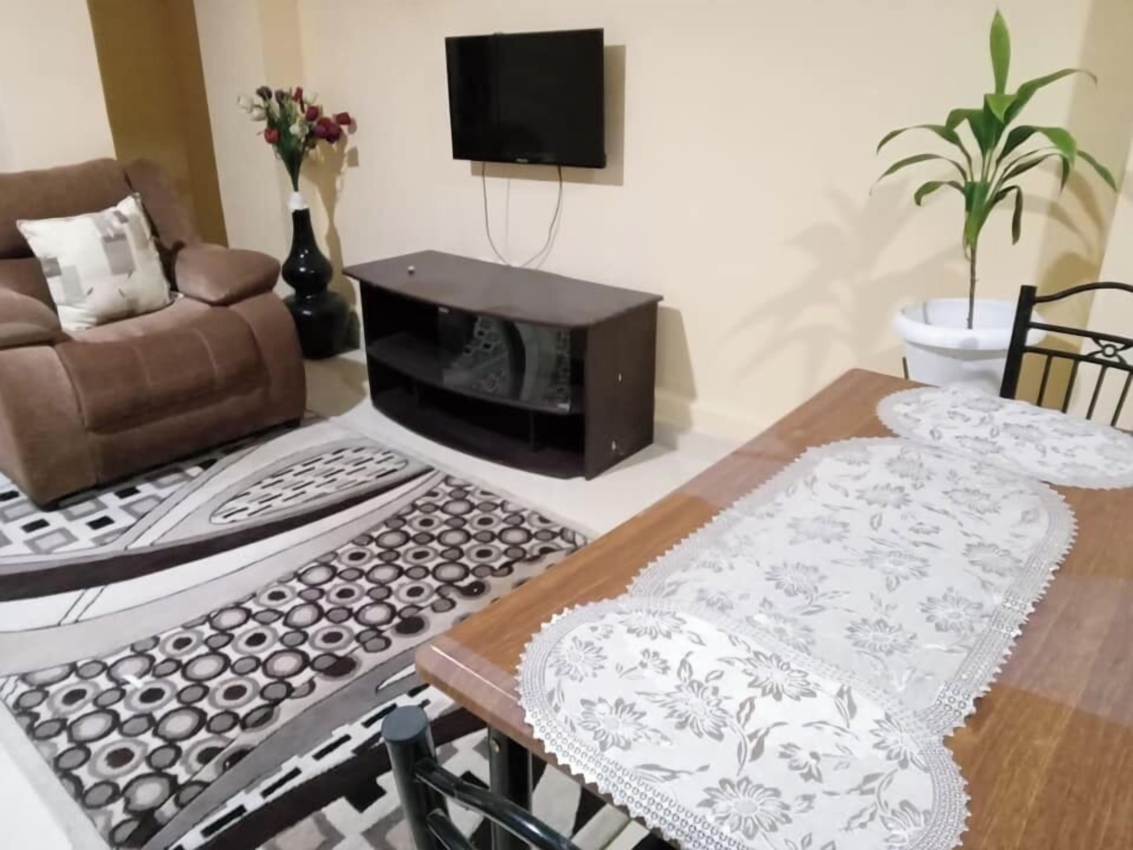 Superior Studio Suite, City View | Living area | 32-inch Smart TV with digital channels