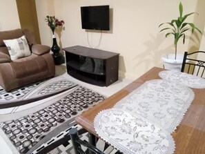Superior Studio Suite, City View | Living area | 32-inch Smart TV with digital channels - Acara Place Kisumu (Kisumu)