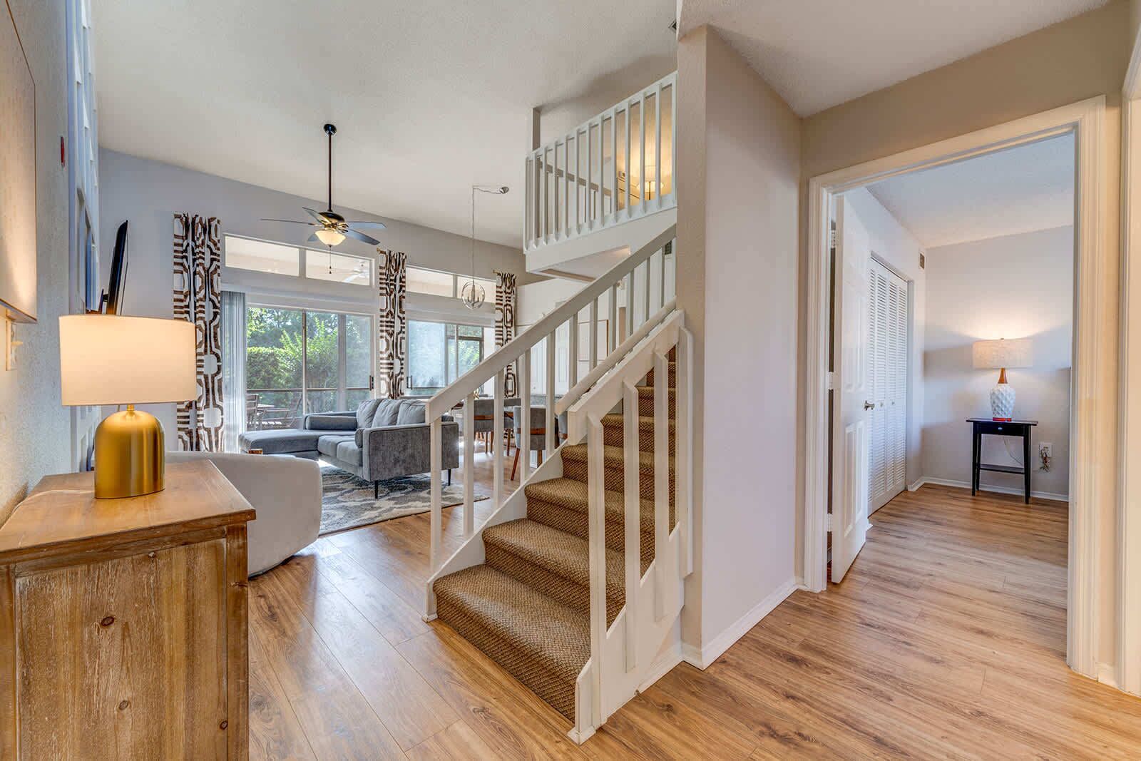Open living area with vaulted ceilings and natural light