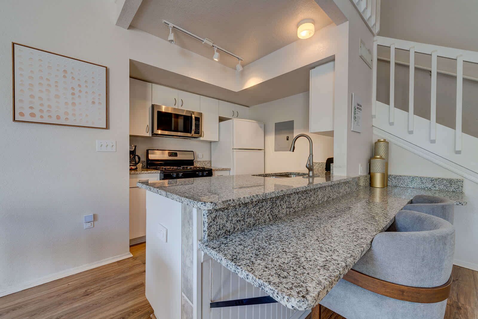 Modern kitchen with granite countertops and stainless steel appliances