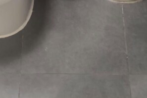 A tiled floor with a visible crack.