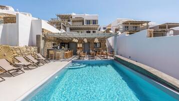 Seasonal outdoor pool, open 11:00 AM to 6:00 PM, sun loungers