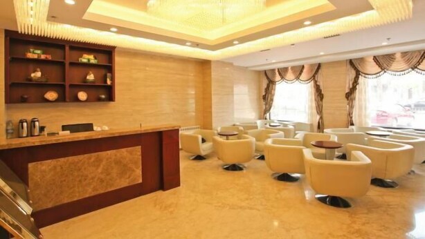 A hotel lobby with a reception desk, seating area, and a chandelier. - 1896 Hotel (Dalian Railway Station Russian Style Street Store) (Dalian)
