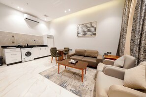 Full-sized fridge, microwave, stovetop, cookware/dishes/utensils - Namar Home serviced Apartment -Tuwaiq (Riyadh)