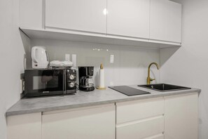 Fridge, microwave, stovetop, coffee/tea maker