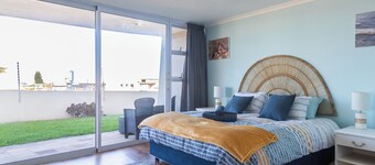 350 metres from beach. 2-bedroom, 2-bathroom ground floor apt with patio & braai