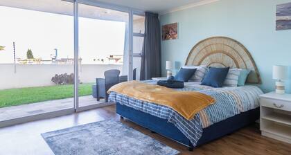 350 metres from beach. 2-bedroom, 2-bathroom ground floor apt with patio & braai