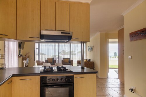 350 metre from beach. 2-bedroom, 2-bathroom ground floor apt with patio & braai
