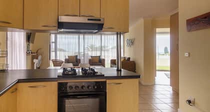 350 metre from beach. 2-bedroom, 2-bathroom ground floor apt with patio & braai