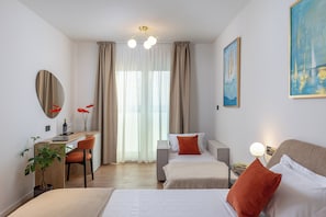 Deluxe Double Room, Partial Sea View | 1 bedroom, hypo-allergenic bedding, memory foam beds, minibar