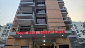 A multi-story hotel with a prominent entrance and a sign reading "HOTEL ROYAL REGENT SUITES". - Royal Regent Suites Dhaka (Dhaka)