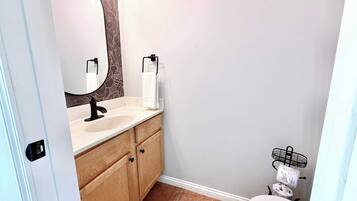 Shower, hair dryer, towels, shampoo