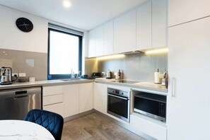 Fridge, microwave, oven, stovetop - Stylish 2-BR Apartment in the Heart of South Perth (South Perth)
