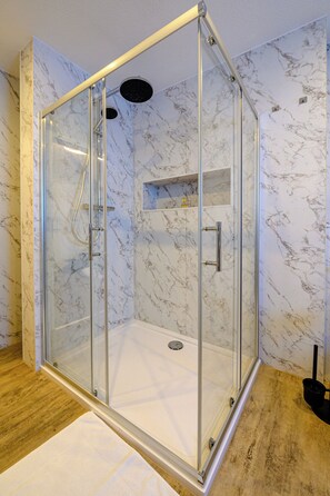 Shower, hair dryer, towels, soap