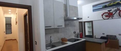 Fridge, microwave, coffee grinder, cookware/dishes/utensils