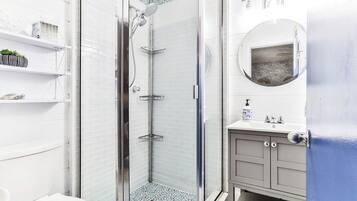 Shower, hair dryer, towels, soap