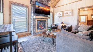 TV, fireplace - *Modern 3BD Cabin w/ Hot Tub + Arcade! Near TOWN!* (Pigeon Forge)