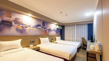 A hotel room with two beds, a desk, and a large abstract painting on the wall.