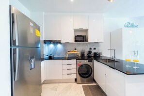Fridge, microwave, stovetop, coffee/tea maker