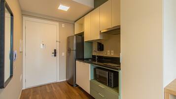 Fridge, microwave, stovetop, coffee/tea maker