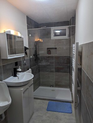 Shower, hair dryer, towels, soap