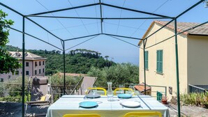 A table set outdoors with a clear view of the surrounding buildings and greenery.