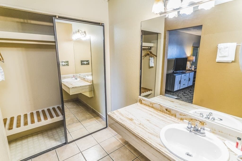 Separate tub and shower, towels, soap, shampoo