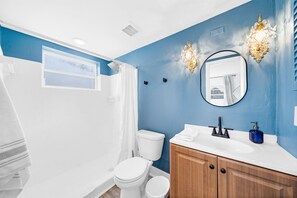 Shower, hair dryer, towels