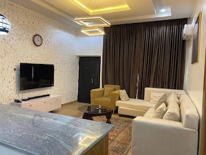 Economy Apartment, Balcony, City View | Living area | Flat-screen TV - Namuba The Residence (Abuja)