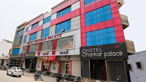 A multi-story building with a prominent sign for 'Hotel Shankar Palace'. - Hotel Shankar Palace Beawar (Beawar)