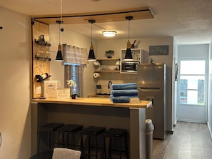 Fridge, microwave, stovetop, coffee/tea maker
