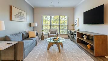 Apartment, 2 Bedrooms | Living area | 50-inch TV with digital channels