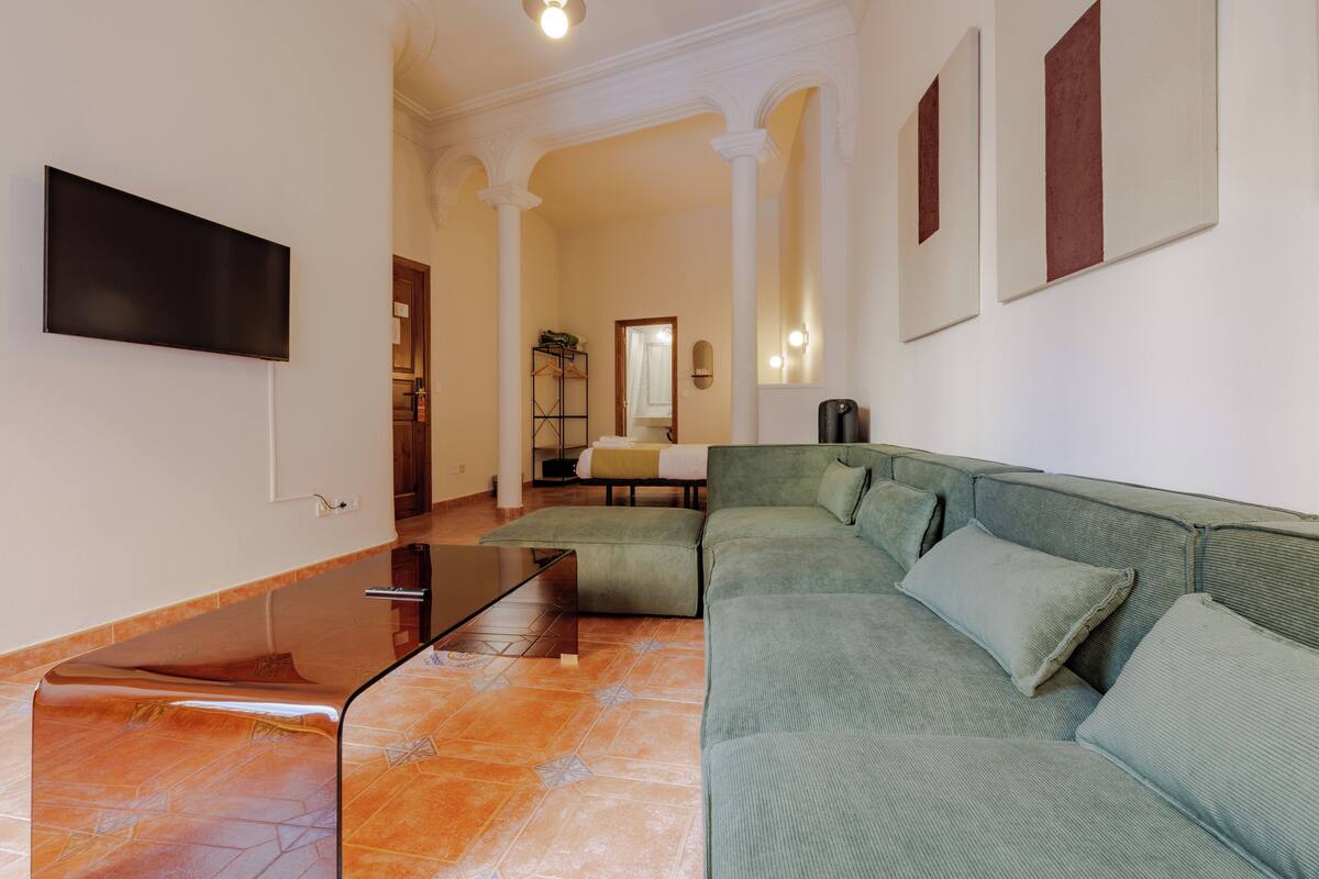 Suite, Balcony, City View | Living area | 43-inch Smart TV with satellite channels