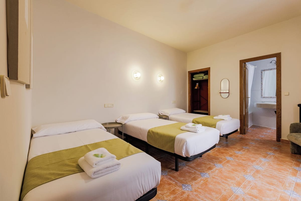 Triple Room | 1 bedroom, memory foam beds, in-room safe, blackout drapes