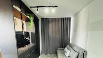 Deluxe-Dreibettzimmer | Wohnbereich