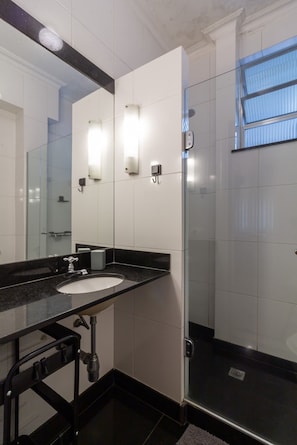 Shower, hair dryer, towels, shampoo