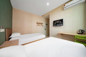 A hotel room with two beds, a desk, a chair, an air conditioner, and a television. - Wangquan Collection Hotel (Shanghai Jinshan City Beach Branch) (Shanghai)