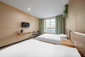 A hotel room with two beds, a TV on the wall, a small table with a cup, and a window with curtains. - Wangquan Collection Hotel (Shanghai Jinshan City Beach Branch) (Shanghai)