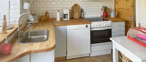 Fridge, stovetop, dishwasher, coffee/tea maker