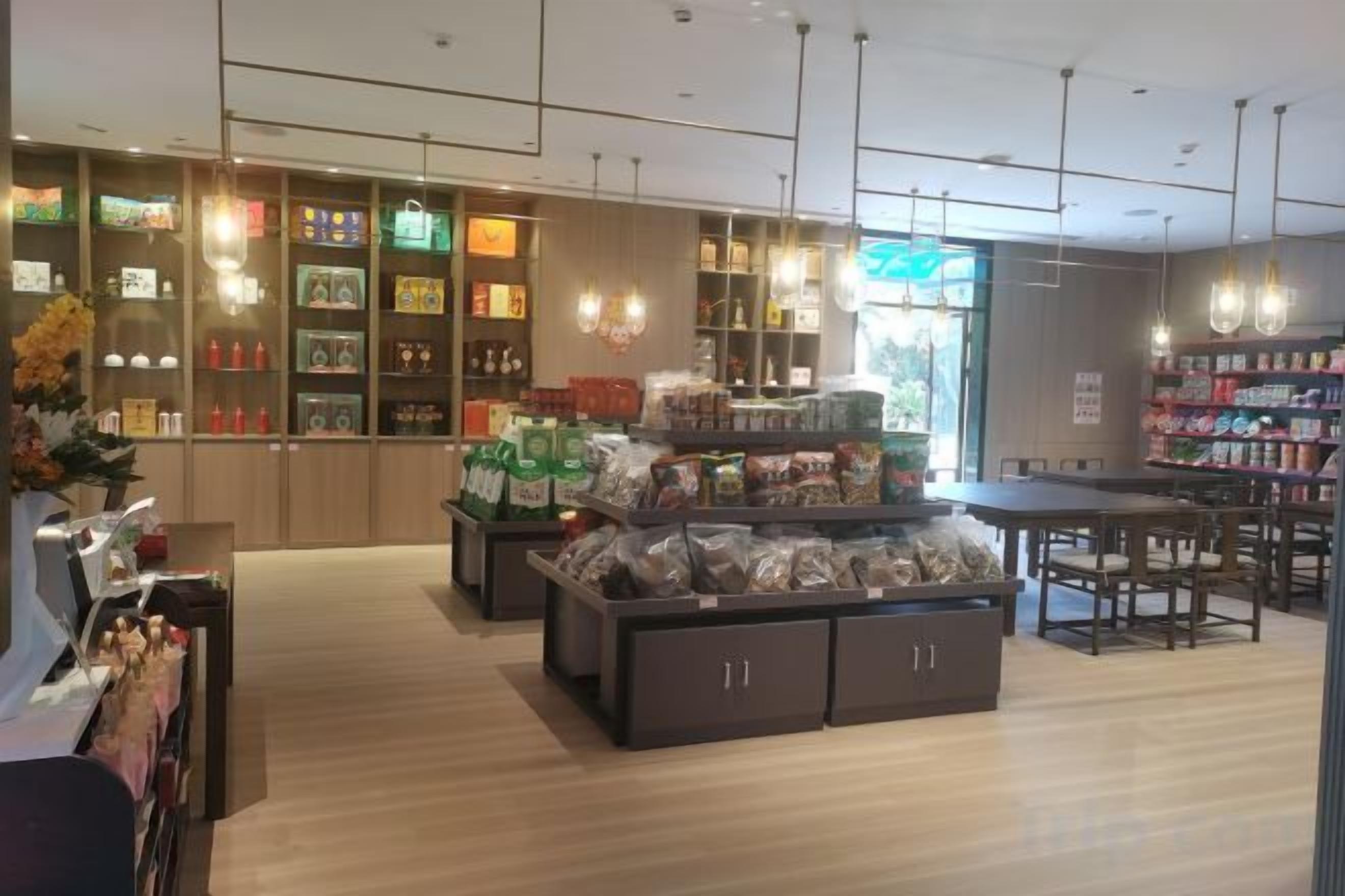 A store interior with shelves, display cases, and seating areas.