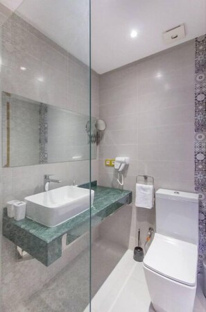 Shower, hair dryer, towels, soap