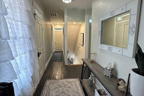 large hallway to bedrooms, bathroom and enclosed porch